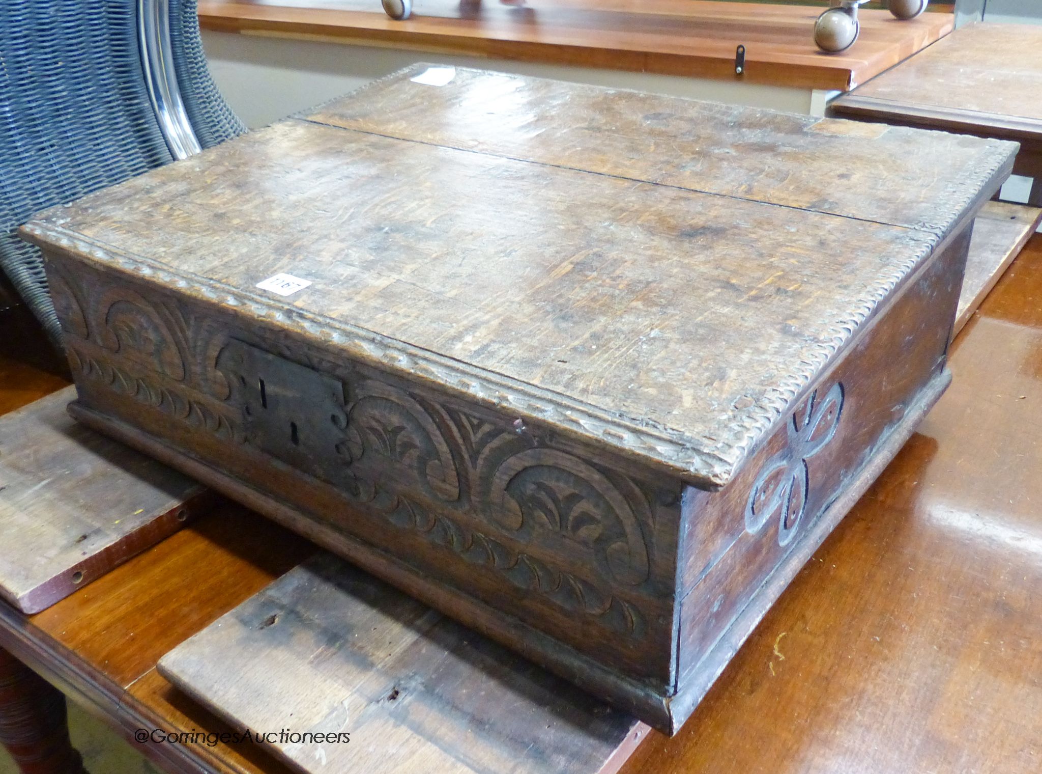An 18th century carved oak bible box. W-61, D-49, H-18.
